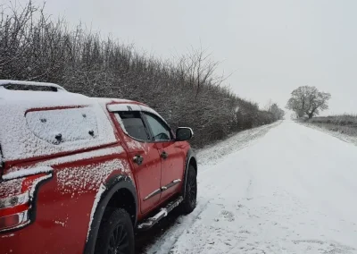 CRL 4x4 on snow-covered rural road
